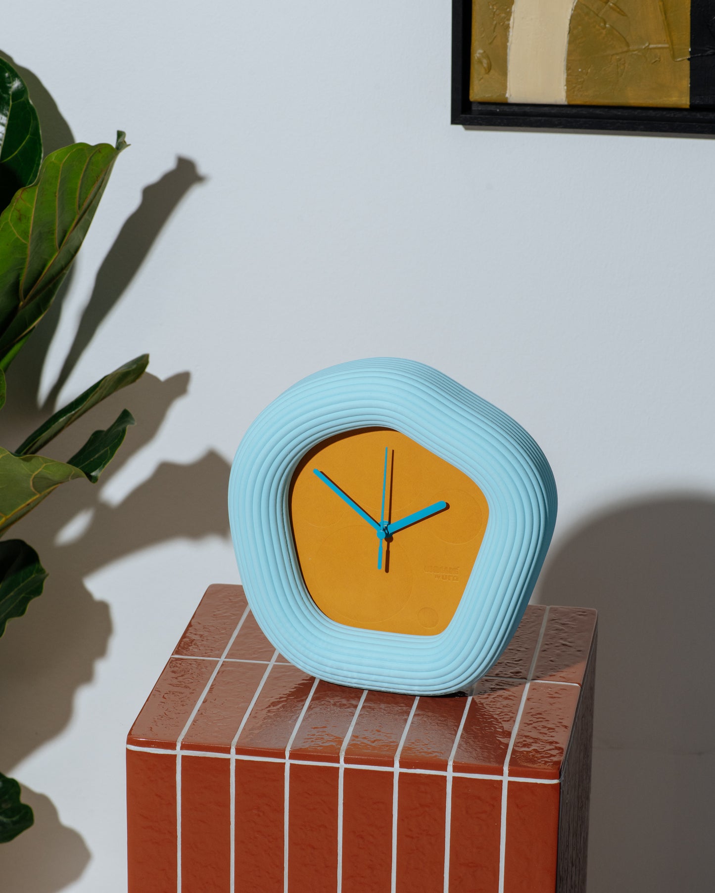 Wallie clock on tile table. Made by Ura Watches / EON TIME