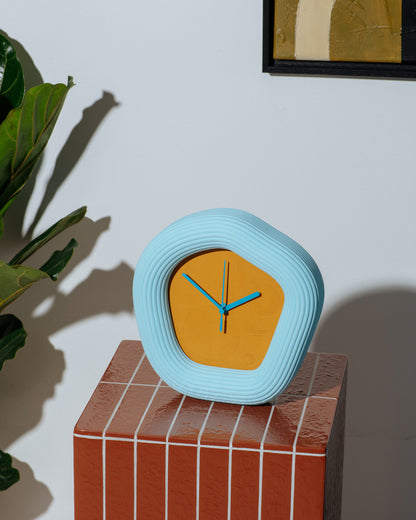 Wallie clock on tile table. Made by Ura Watches / EON TIME