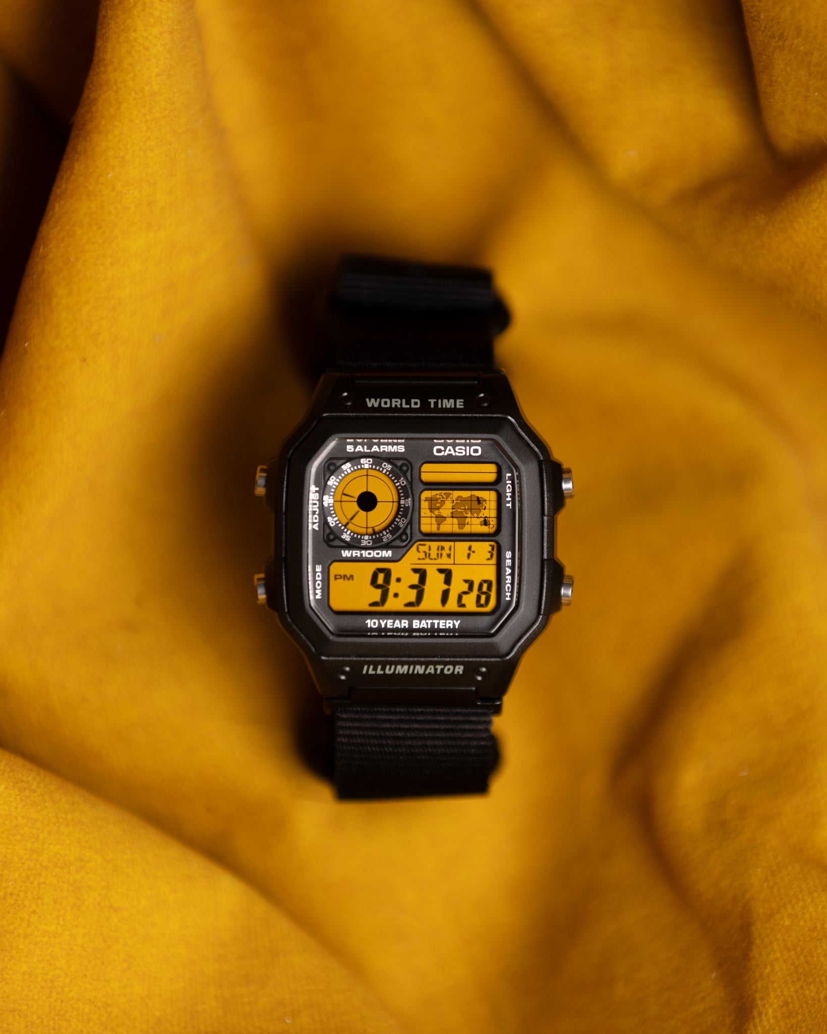 Custom Casio AE-1200 “Yellowstone” by EON Time

Made with one purpose in mind - to be as legible as possible. Good for sports and every activity in which you can’t lose track of time. We used double yellow polarization method in order to make this screen contrast-rich, numbers look much sharper than traditional yellow foil. Paired to black 22mm nylon strap and ready for adventure.