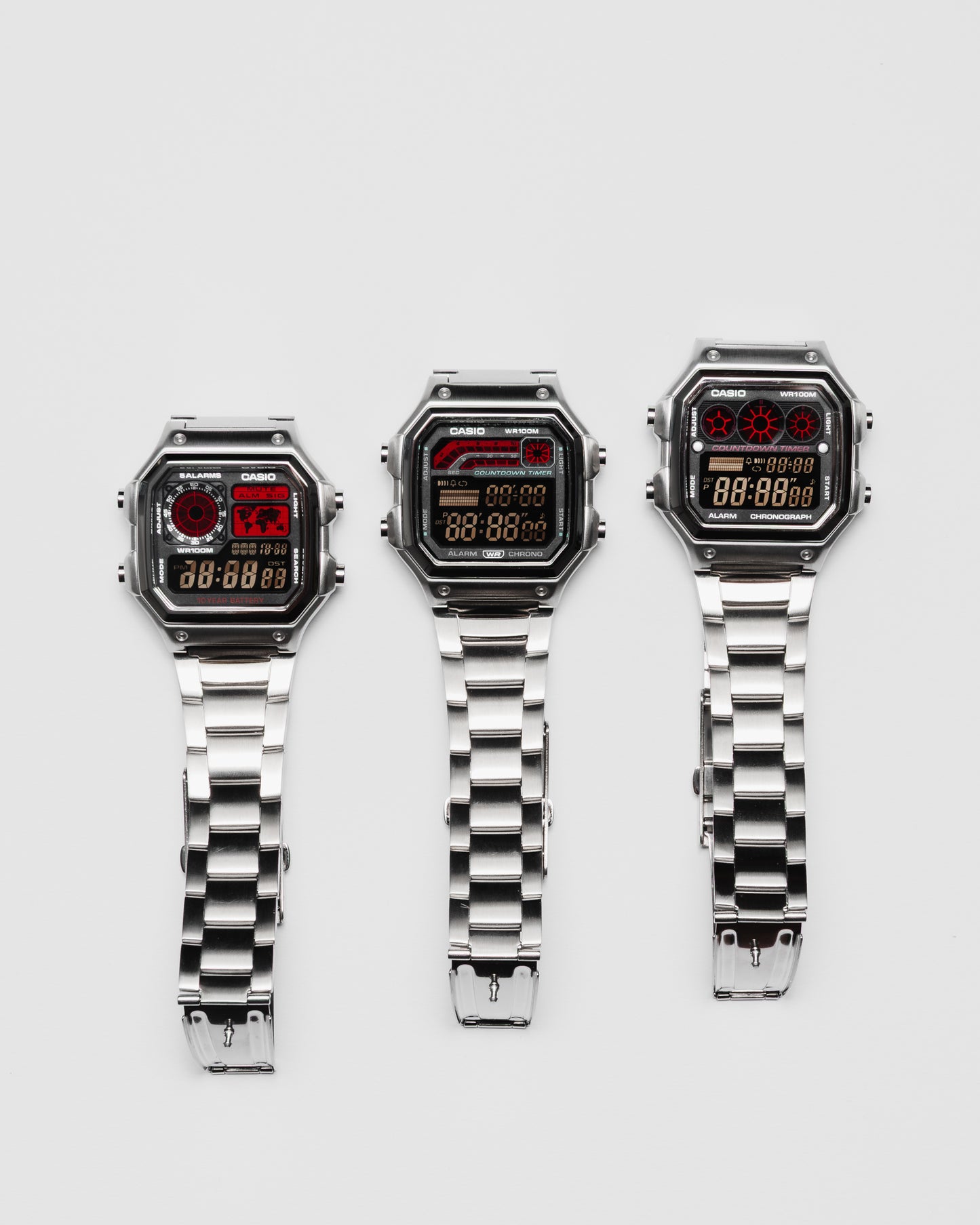 EON Redline Full Metal AE-1300 custom Casio digital watch with red and black display, stainless steel case and bracelet with a full redline set\.