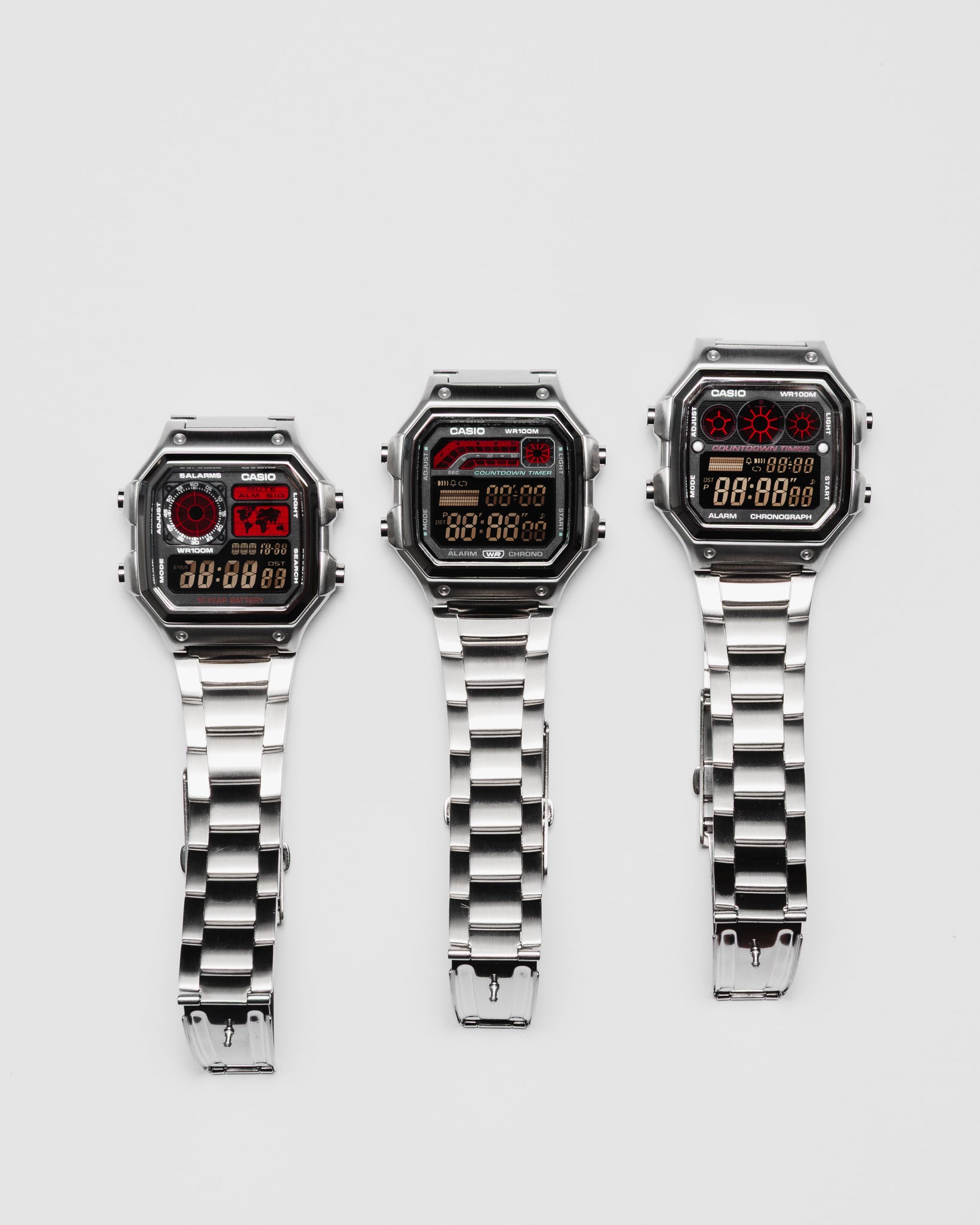 EON Redline Full Metal AE-1300 custom Casio digital watch with red and black display, stainless steel case and bracelet with a full redline set\.